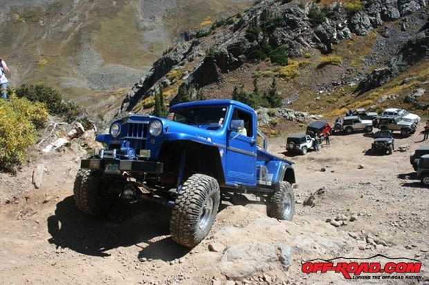 A beautiful blue 1948 Willys pickup looks good on any trail, and its Chevy 350 idles up most any hill.