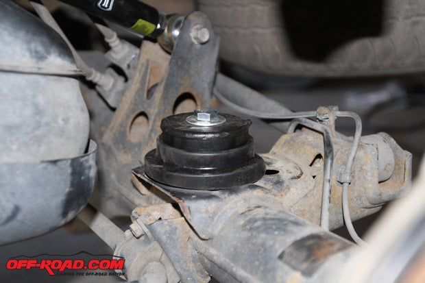 The Metal Tech 4x4 hardware to hold the spring in place mounts directly to the preexisting hole on the rear axle where the air bags previously resided. 