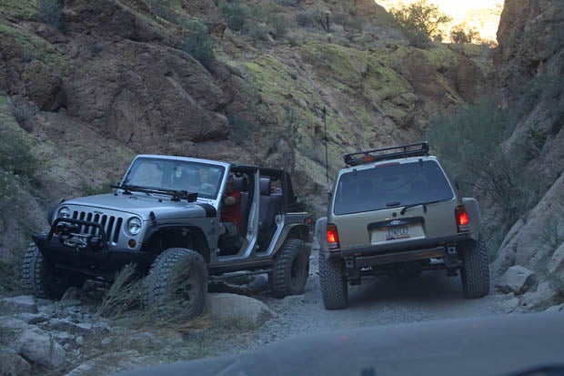 Four-door JK Wranglers are decidedly bigger than side-by-sides, but the JKs driver made good use of his rigs capability and straddled a boulder to let us by.