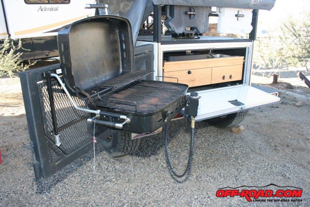 If you opt for the optional Side Kick Grill ($149), it slides into brackets on swing-out tailgate and connects to the included LPG hose thats already routed to the galley.