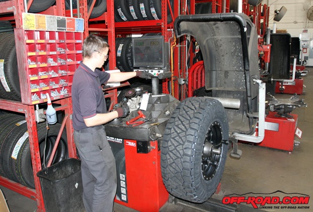 Tyler helps get our new wheels and tires balanced prior to installation. We were happy to see that the most weight any one tire needed is 3.5 ounces (and the least was 1 ounce).
