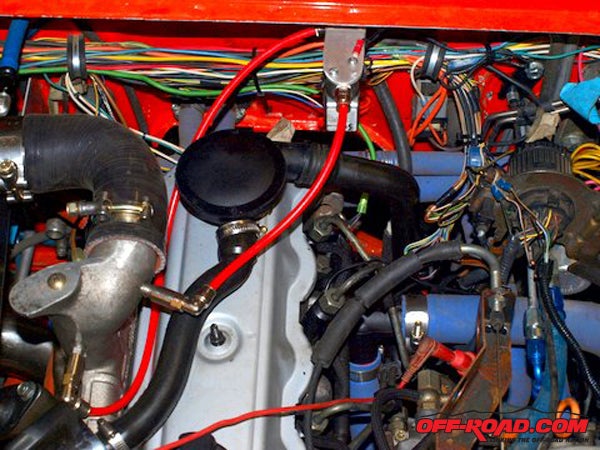 The red hoses go to the solenoid and the jets on the intake manifold.