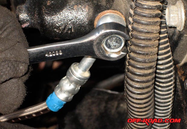 Using a 12mm flat nut wrench to tighten the banjo nut at the clutch master cylinder end works best. Make sure not to over tighten or use too much force. The special hydraulic bolt is center bored and will cave in under too much torque.
