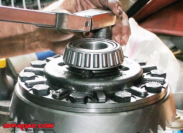 The carrier, ring, pinion, side gears, and bearings must be assembled properly. The carrier must be torqued to the ring gear according to the manufacturers specification.