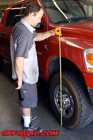 Brian Carta from ORW measuring the height of our Dodge Ram Turbo Diesel 2500 before installing the KORE HP Series Leveling System.  It measured 39 ¾ inches with 285/75R17 BFG All-Terrain tires.