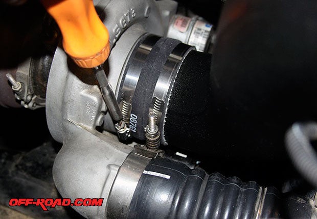 Theres a separate bracket that bolts on to the alternator, which helps support the intake tube. Once thats in place, you can proceed to slip the tube into the turbo. Use the supplied hose clamps to tighten and get a good seal on the turbo inlet.